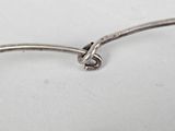 an image of a close up of a spoon with a knot on it