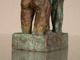 a bronze statue of a man and a dog on a pedestal