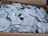 a cardboard box filled with a lot of clothes