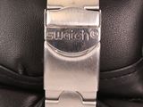 a close up of a watch on a leather case