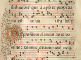 an old manuscript with a red and black writing on it