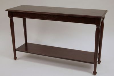a wooden table with a shelf underneath it on a white background