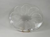 a glass plate with a design on it on a stand