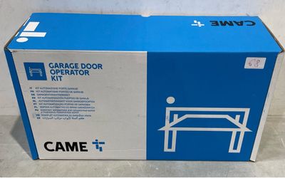 a cardboard box with a picture of a garage door operator ' s kit