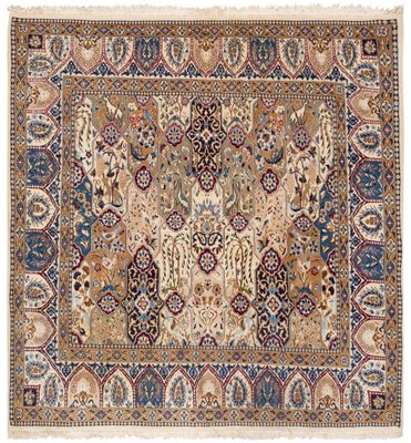 an antique persian rug with a floral design