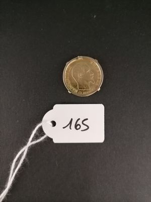 a close up of a coin with a tag attached to it