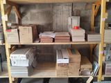 many boxes and boxes on a shelf in a room