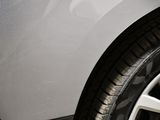 a close up of a car ' s tire on the street