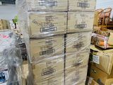 a large stack of boxes sitting on the floor in a warehouse