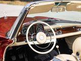 a red and white car with a steering wheel and dashboard