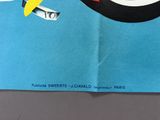 a blue book with a penguin on it and a banana on top of it