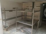 a room that has a bunch of shelves in it