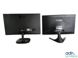 two computer monitors sitting side by side on a white surface