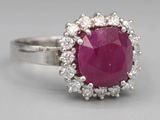 an image of a ruby and diamond ring on a white background
