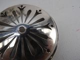 a close up of a silver object on a table