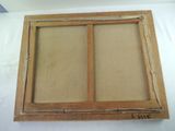 an old picture frame with a picture of a window in it