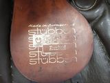 a close up of a saddle with a leather cover on it