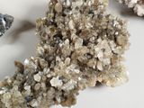 a cluster of crystals on a white surface