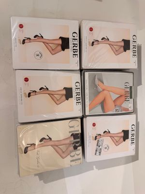 six pairs of women ' s stockings are stacked on top of each other