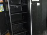 an image of a refrigerator in a kitchen with the door open