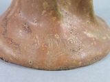 a close up of a clay sculpture of a man ' s head