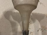 a glass vase that is sitting on a table