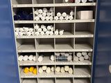 many rolls of toilet paper on the shelves in the bathroom