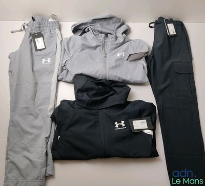 un ensemble de vêtements pour hommes disposés sur une surface blanche