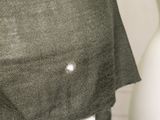 a close up of a shirt with a hole in it