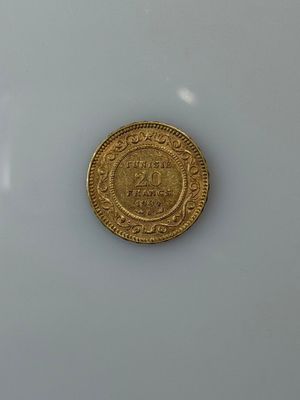 an image of a gold coin on a white surface