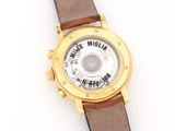 an image of a gold wrist watch with a brown leather strap