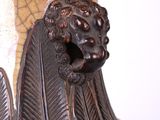 a large vase with a lion head on the top of it