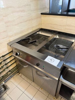 a kitchen with a sink and a stove in it
