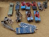 a lot of toy trains that are sitting on the ground