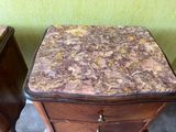 a small table with a marble top on it