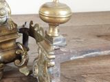 a small antique coffee grinder sitting on a wooden table