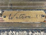 an image of a close up of a sign on a metal object