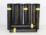 four black and yellow cylinders are stacked on top of each other