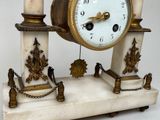 a clock that is sitting on top of a table