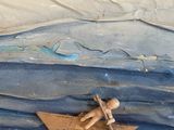 a cake that has a man in a boat on it