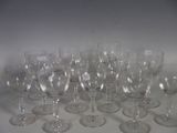 many empty wine glasses sitting on a white surface