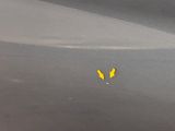 a yellow arrow pointing to the left on the street