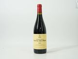 a bottle of wine that is sitting on a table