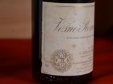 a bottle of wine that is sitting on a table
