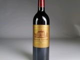 a bottle of wine that is sitting on a table