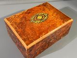 an image of a wooden box with a decorative design on it