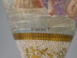 a close up of a vase with a painting on it