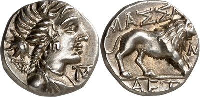 a silver coin with an image of a horse on it