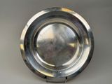 a silver plate that is sitting on a table