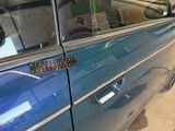 an image of a blue car with a sticker on the door